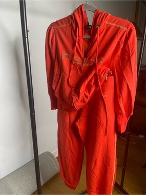 bebe Bright Red Hooded Jumpsuit with Logo Accent